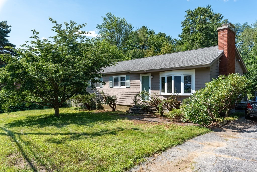 126 Baldwin Road Billerica, MA 01821 - Photo 1 of 30 a front view of a house with a yard