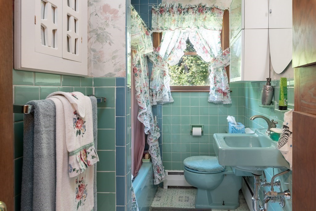 126 Baldwin Road Billerica, MA 01821 - Photo 11 of 30 a bathroom with a toilet sink and garden view