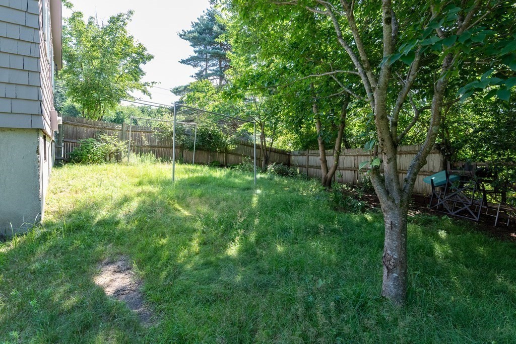 126 Baldwin Road Billerica, MA 01821 - Photo 28 of 30 a backyard of a house with lots of green space