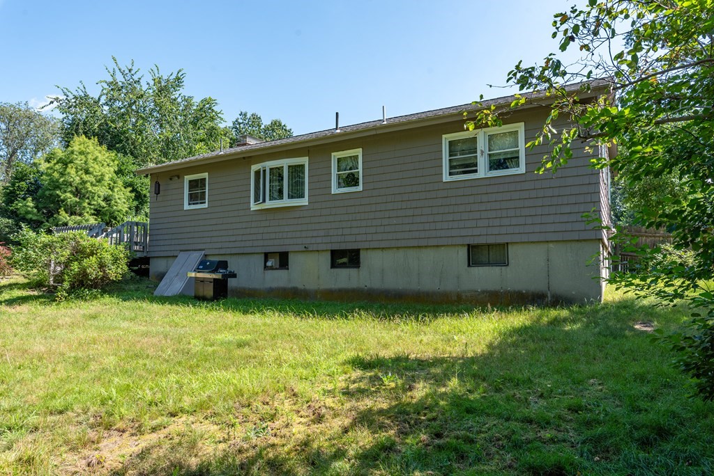 126 Baldwin Road Billerica, MA 01821 - Photo 30 of 30 a backyard of a house with lots of green space
