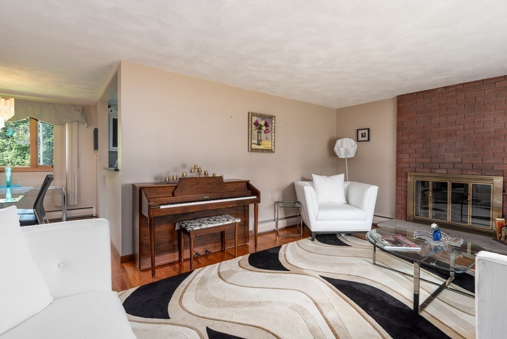 126 Baldwin Road Billerica, MA 01821 - Photo 4 of 30 a bedroom with a bed and a fireplace