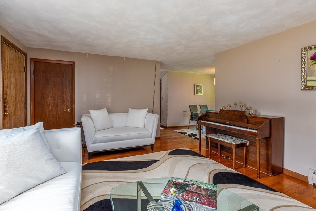 126 Baldwin Road Billerica, MA 01821 - Photo 5 of 30 a living room with furniture and a dresser