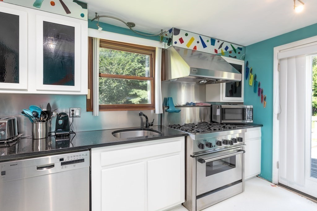 126 Baldwin Road Billerica, MA 01821 - Photo 6 of 30 a kitchen with a stove and a sink