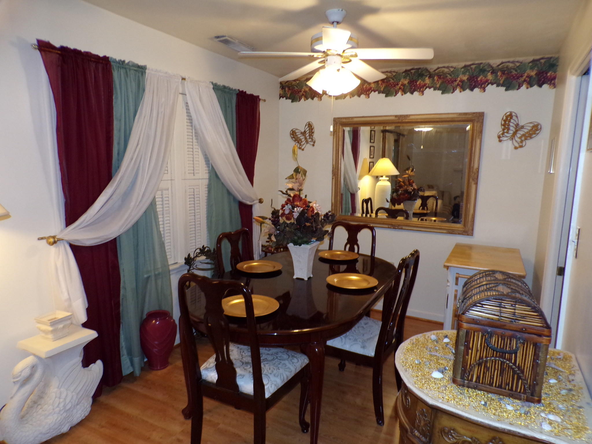2229 Ranch Road Northwest Roanoke, VA 24017 - Photo 8 of 37 a view of a dining room with furniture and a chandelier fan