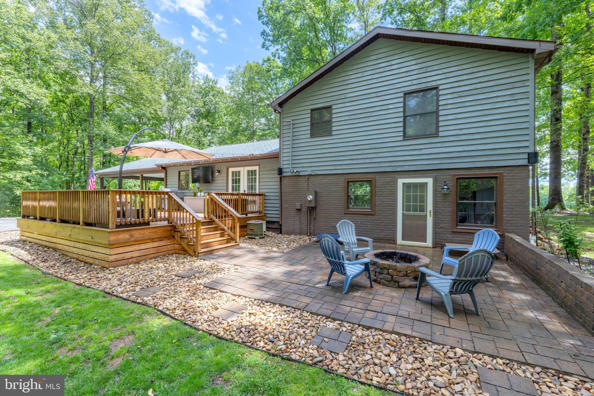 1425 Jacks Shop Road Rochelle, VA 22738 - Photo 46 of 56 a view of a house with backyard sitting area and garden
