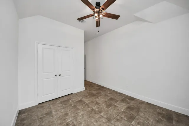 a bathroom with a sink vanity mirror and toilet