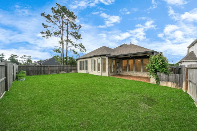 a view of backyard with green space