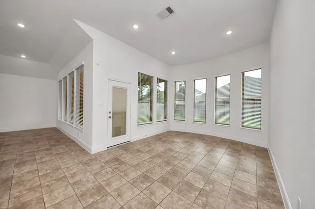 a view of an empty room with a window