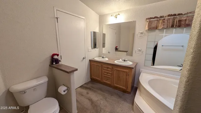 a spacious bathroom with a sink toilet and shower