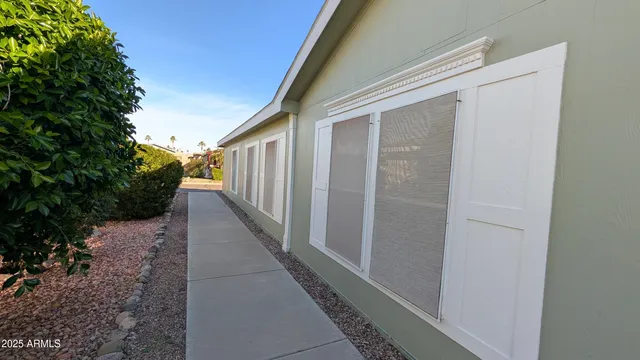a view of a pathway of a house with backyard