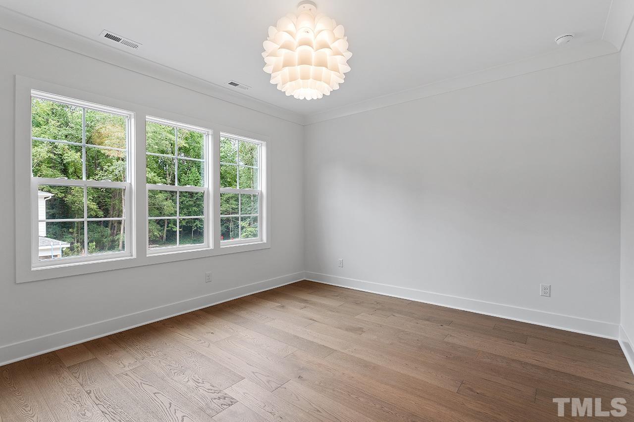 6502 Brecken Pnes Court Raleigh, NC 27612 - Photo 21 of 32 an empty room with a window