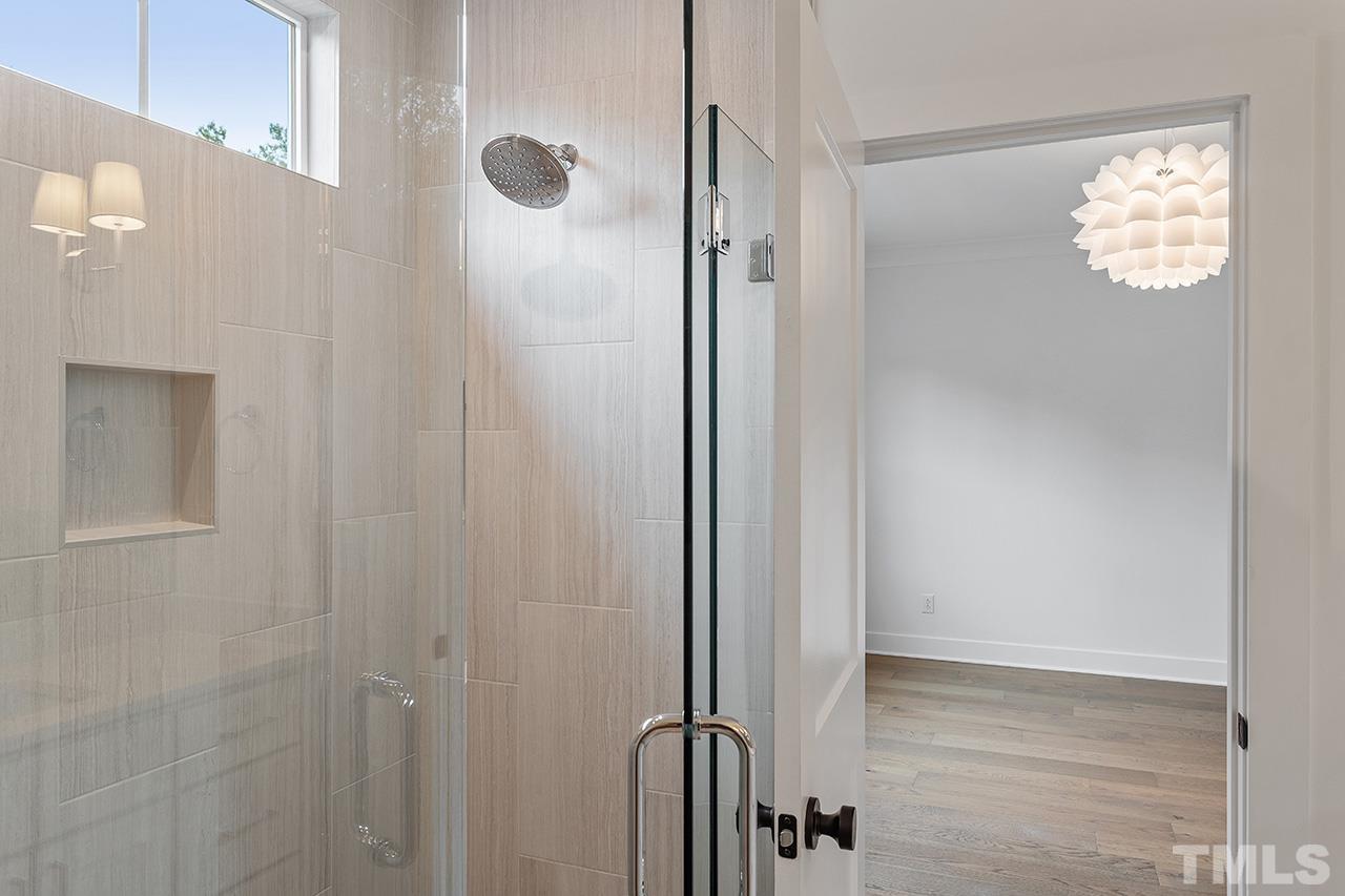 6502 Brecken Pnes Court Raleigh, NC 27612 - Photo 23 of 32 a view of a bathroom with shower