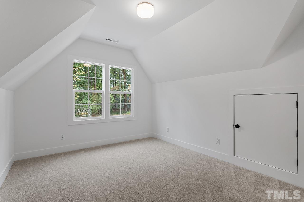 6502 Brecken Pnes Court Raleigh, NC 27612 - Photo 27 of 32 an empty room with a window