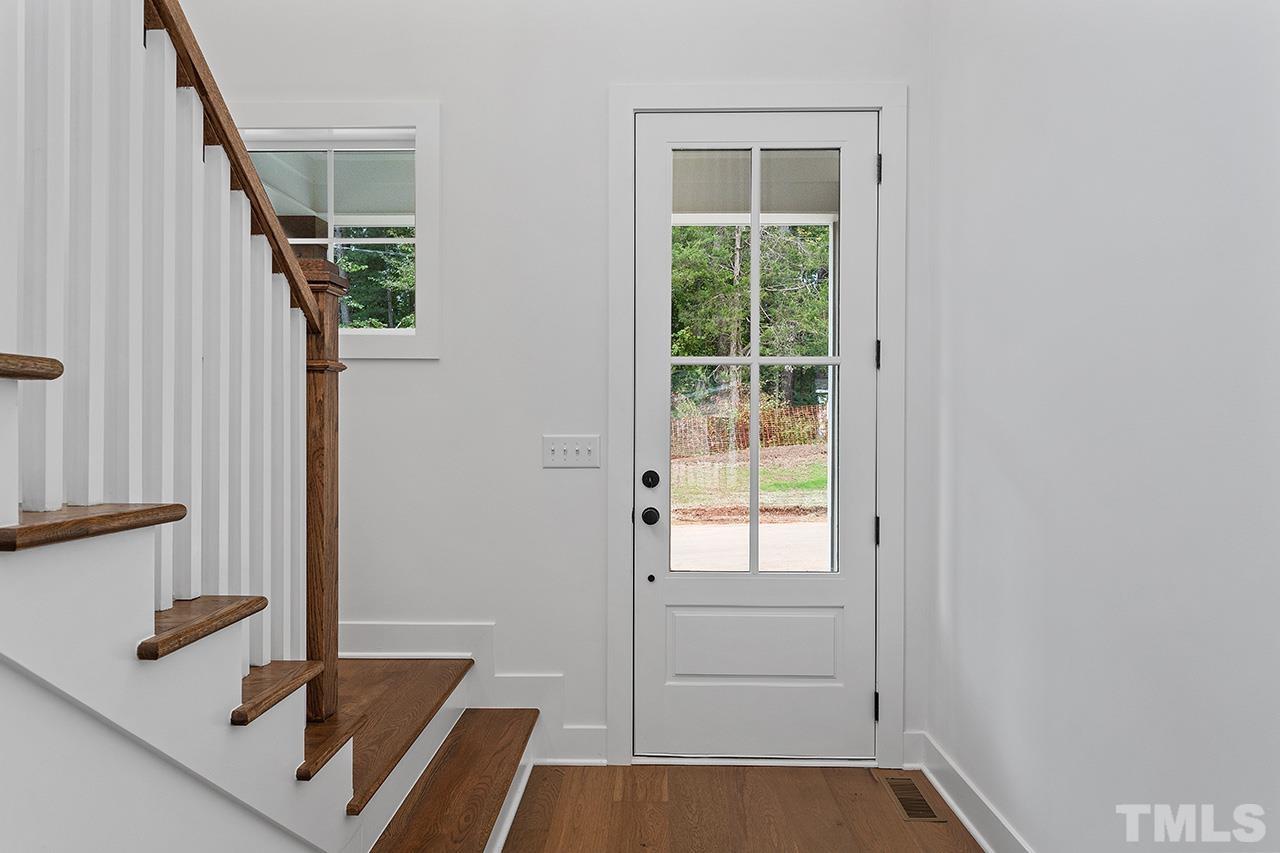6502 Brecken Pnes Court Raleigh, NC 27612 - Photo 4 of 32 a view of front door and bedroom