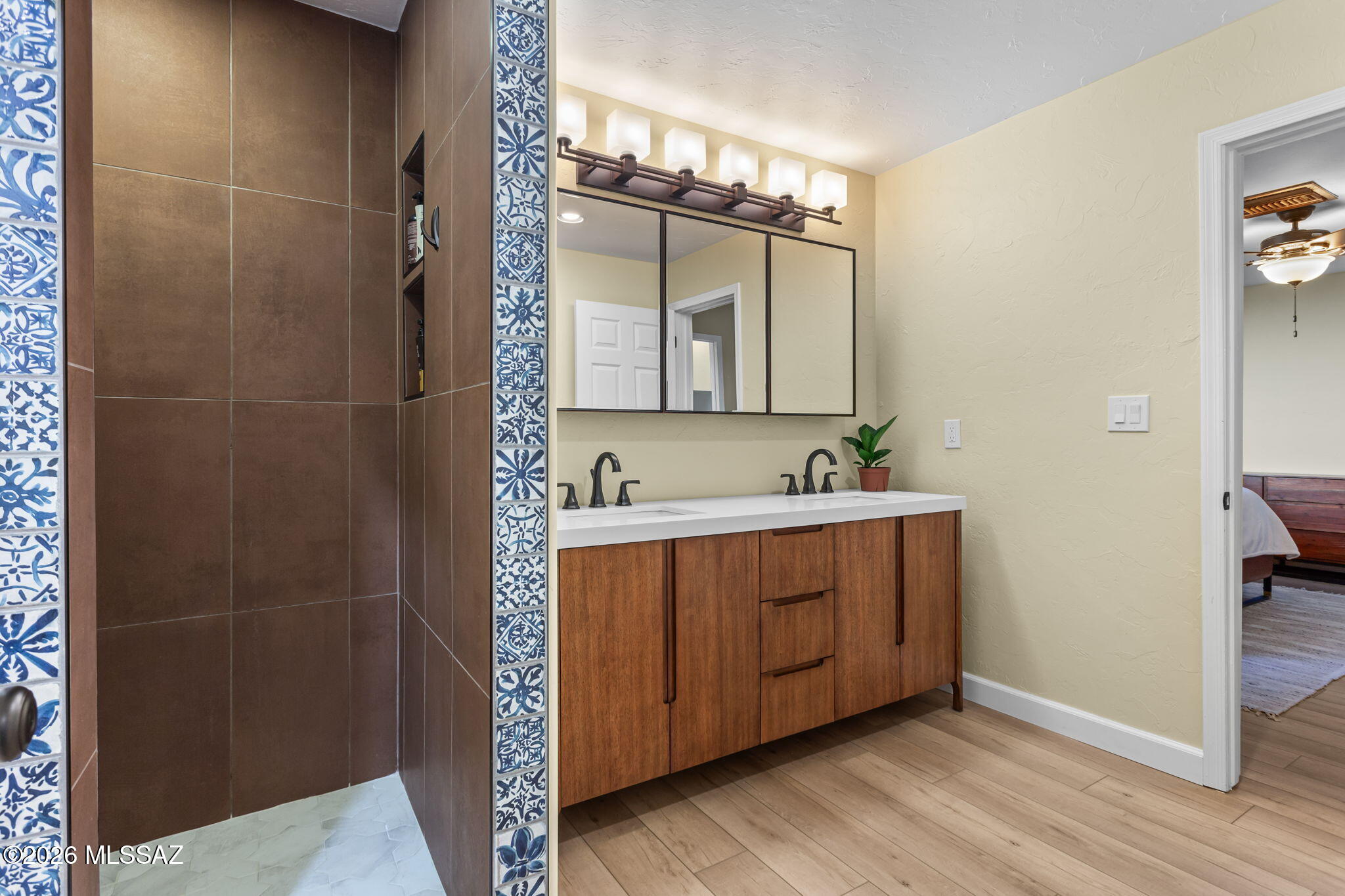 4210 West Mossman Road Tucson, AZ 85746 - Photo 30 of 51 a bathroom with a sink and mirror