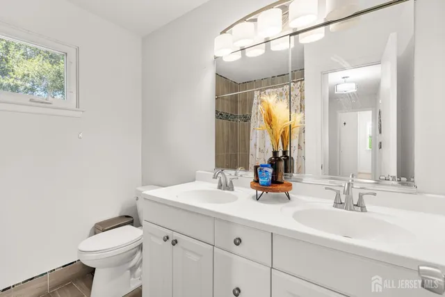 a bathroom with a bathtub and shower