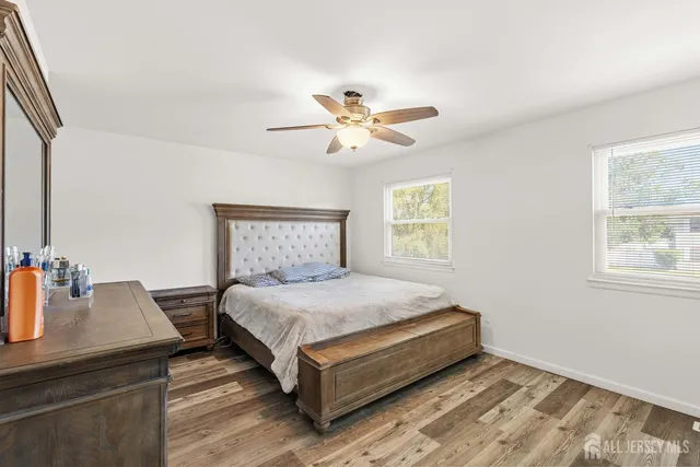 a room with a bed and cabinets