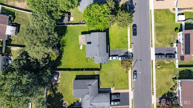 an aerial view of a house with a swimming pool