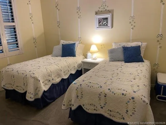 a bedroom with bed and window