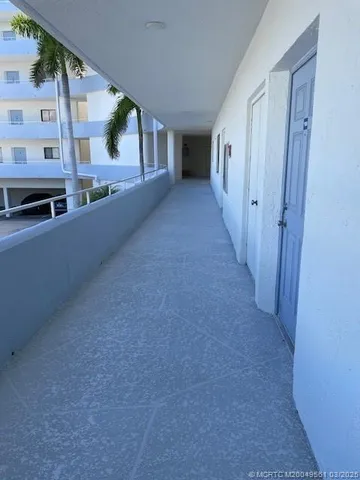 a view of a living room with a fireplace