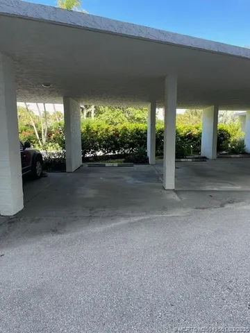 a view of a porch and garden