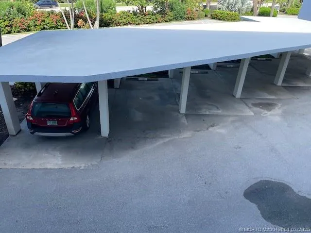 a view of balcony with wooden floor and fence