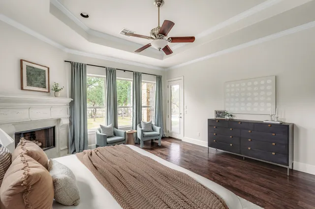 a living room with furniture fireplace and flat screen tv