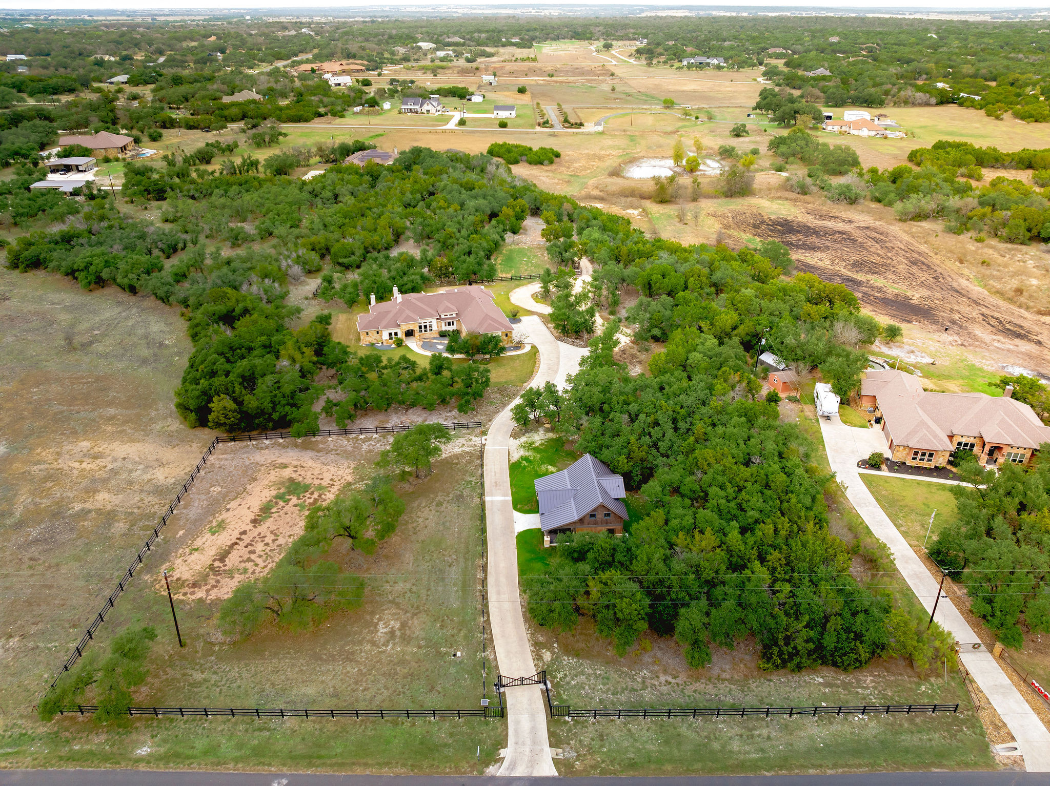 an aerial view of residential houses with outdoor space