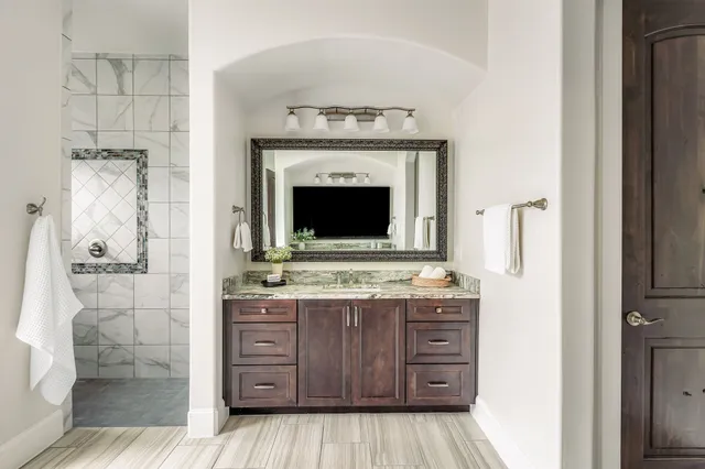 a bathroom with a sink and a mirror