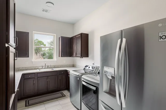 a kitchen with a stove and a refrigerator