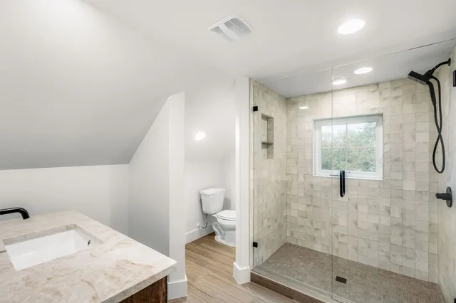 a view of storage and utility room with washer and dryer