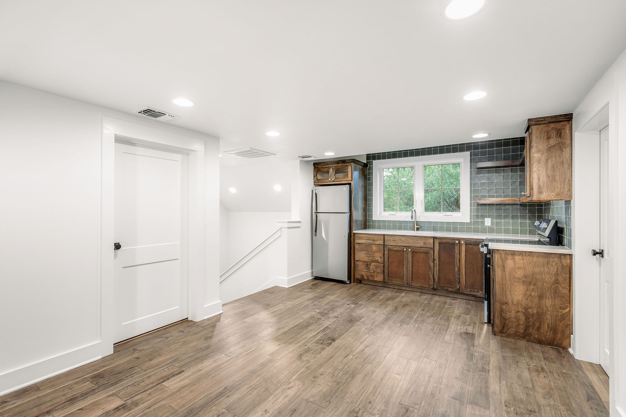 812 Jennings Branch Georgetown, TX 78633 - Photo 32 of 40 a large kitchen with a wooden floor and a window