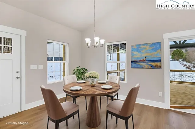 a dining room with furniture and window