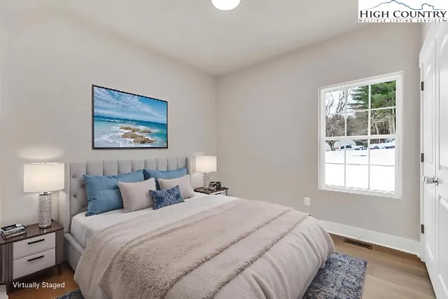 a bedroom with bed and a window