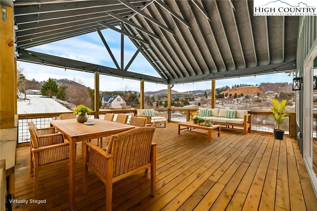 a view of a swimming pool with outdoor seating