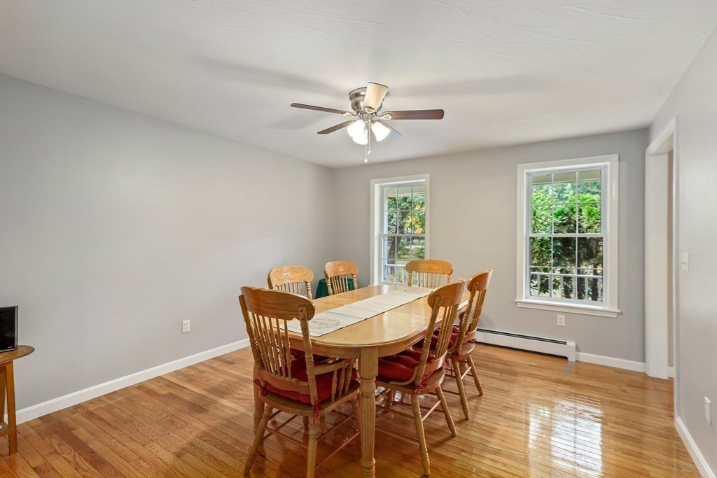 11 Easter Brook Road Lunenburg, MA 01462 - Photo 13 of 41 a dining room with furniture a chandelier and wooden floor