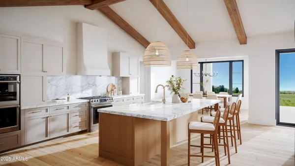 a kitchen with stainless steel appliances kitchen island granite countertop a refrigerator and a stove top oven