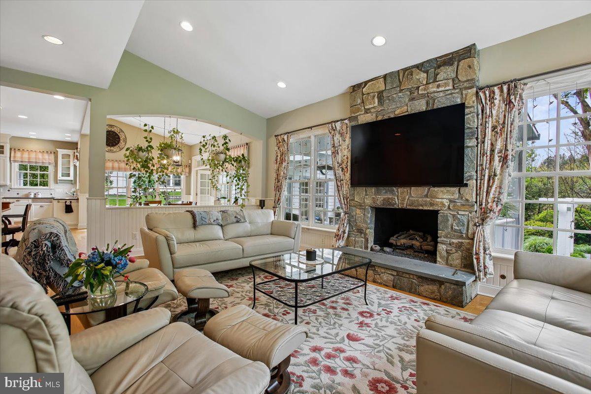 6809 Sorrel Street McLean, VA 22101 - Photo 22 of 101 a living room with furniture a flat screen tv and a fireplace