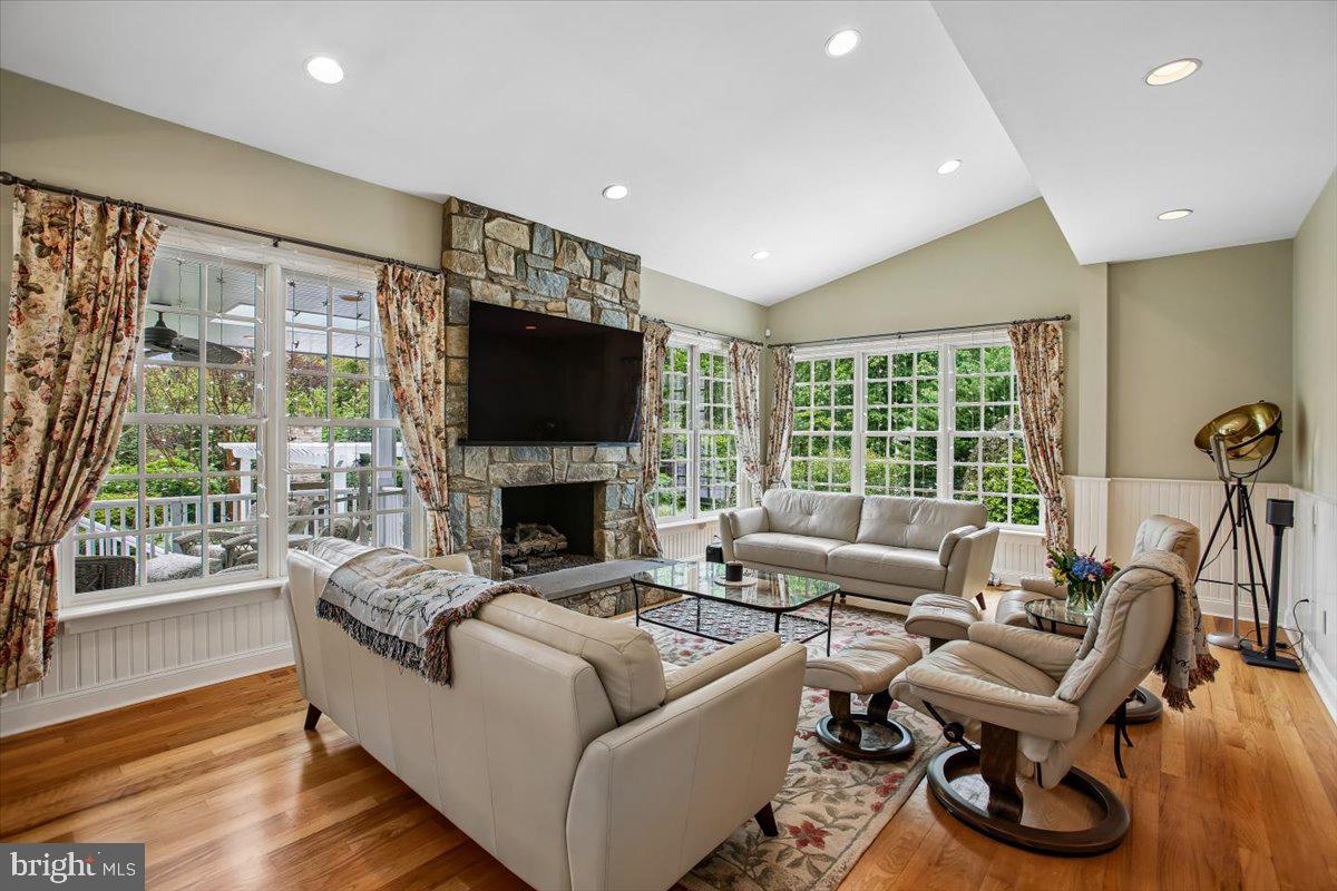 6809 Sorrel Street McLean, VA 22101 - Photo 23 of 101 a living room with furniture a flat screen tv and a fireplace