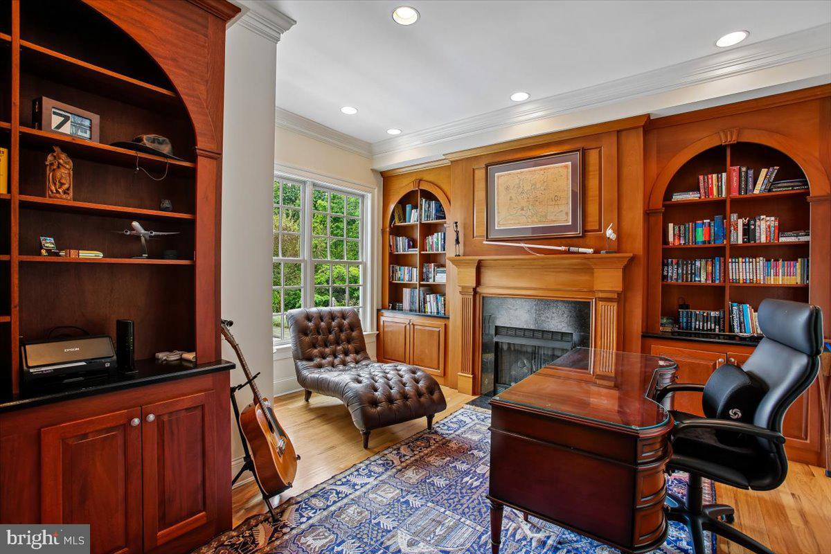 6809 Sorrel Street McLean, VA 22101 - Photo 24 of 101 a living room with fireplace furniture and a floor to ceiling window or shelf