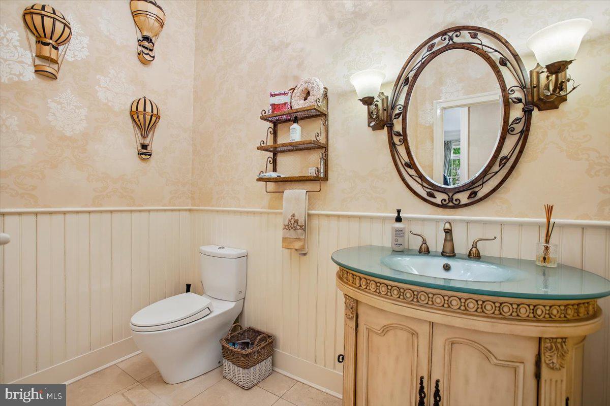 6809 Sorrel Street McLean, VA 22101 - Photo 27 of 101 a bathroom with a toilet sink and mirror