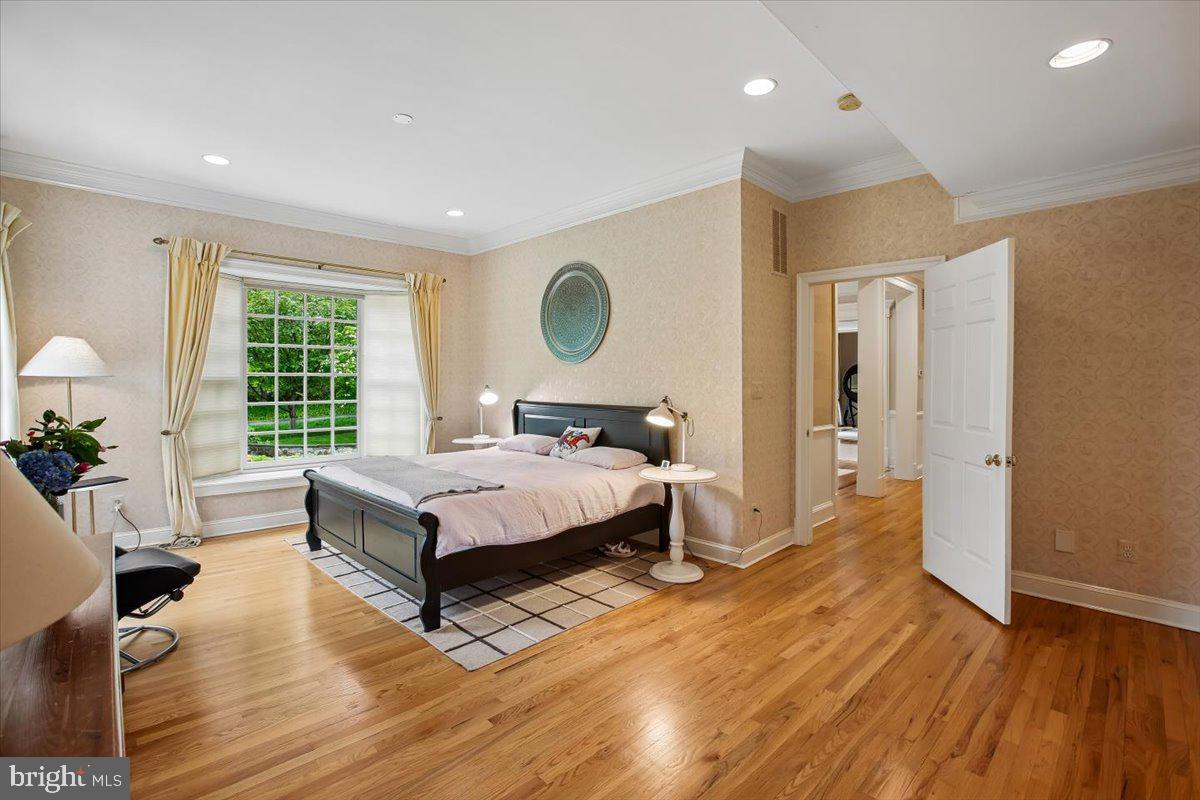 6809 Sorrel Street McLean, VA 22101 - Photo 28 of 101 a bedroom with a bed and wooden floor