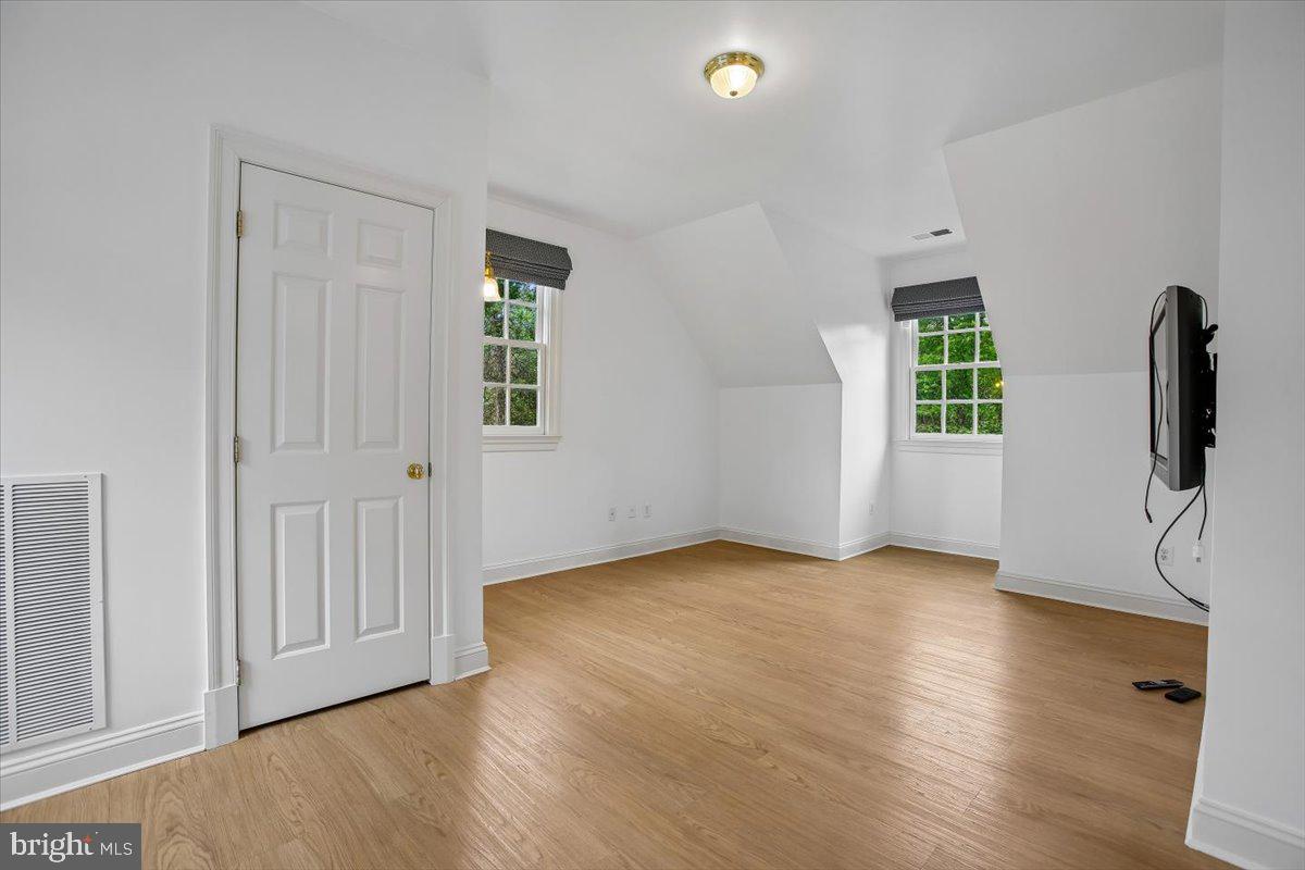 6809 Sorrel Street McLean, VA 22101 - Photo 38 of 101 an empty room with wooden floor and windows