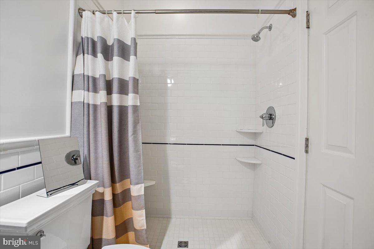 6809 Sorrel Street McLean, VA 22101 - Photo 39 of 101 a bathroom with a shower and a toilet