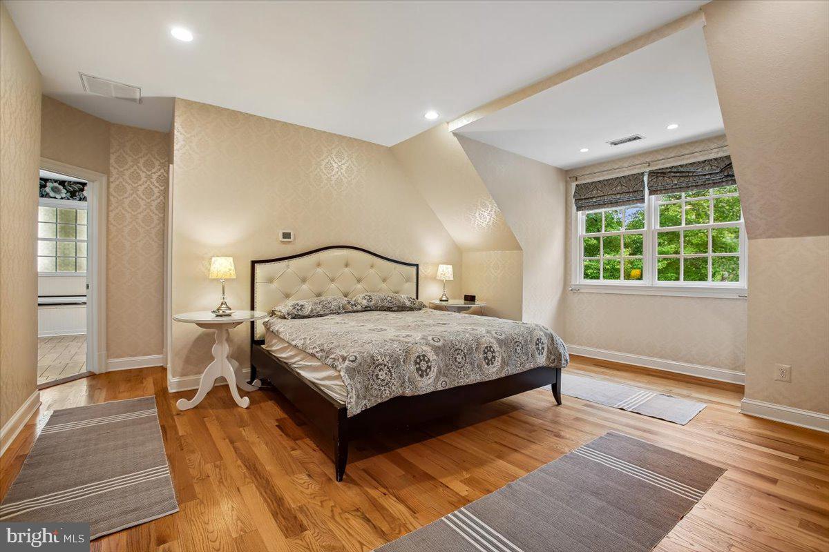 6809 Sorrel Street McLean, VA 22101 - Photo 41 of 101 a bedroom with a large bed and a window