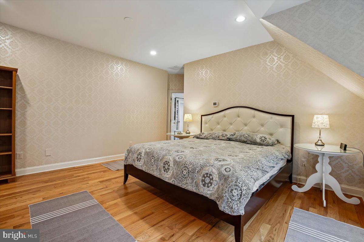 6809 Sorrel Street McLean, VA 22101 - Photo 43 of 101 a bedroom with a bed and wooden floor