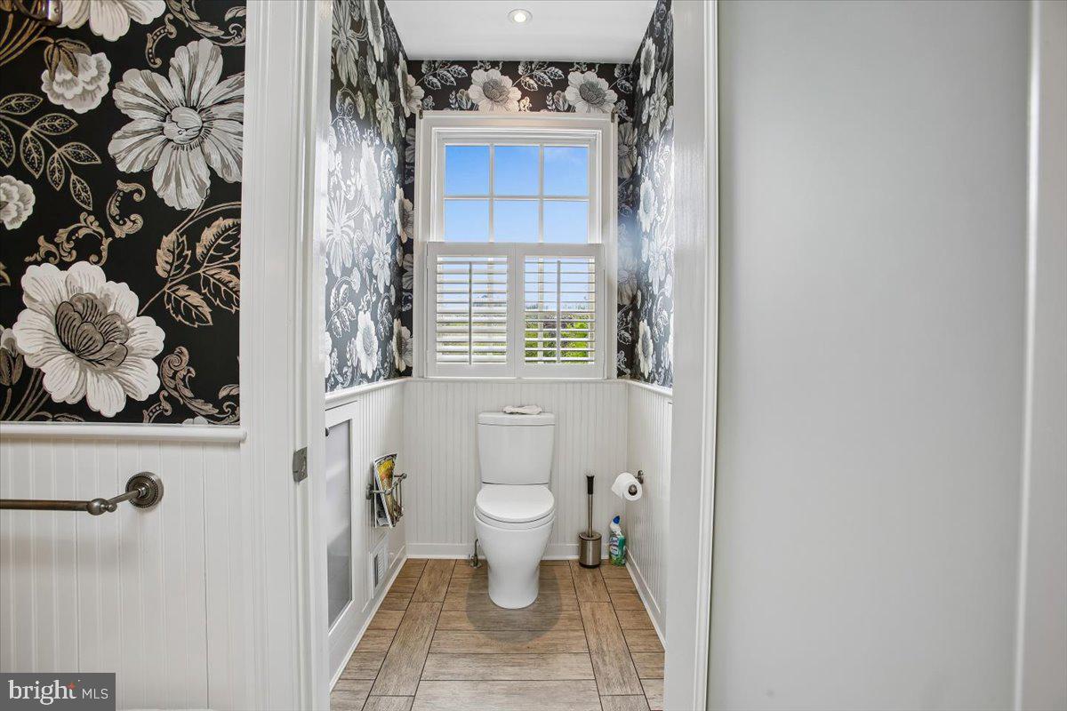 6809 Sorrel Street McLean, VA 22101 - Photo 47 of 101 a bathroom with a toilet and a shower curtain