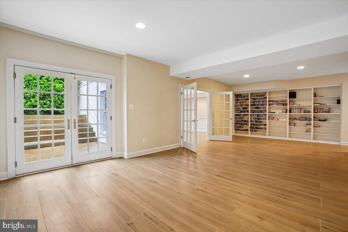 6809 Sorrel Street McLean, VA 22101 - Photo 59 of 101 a view of an empty room with wooden floor and a window
