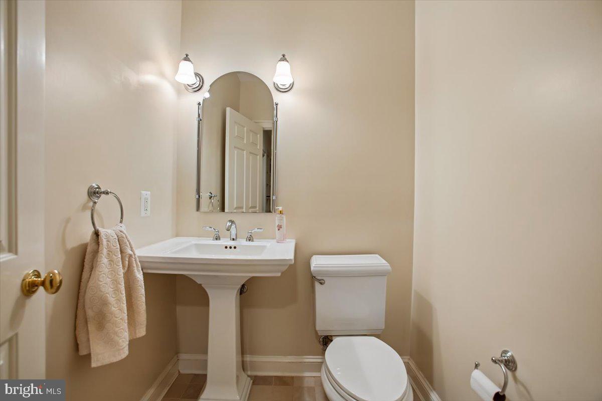 6809 Sorrel Street McLean, VA 22101 - Photo 61 of 101 a bathroom with a toilet sink and mirror