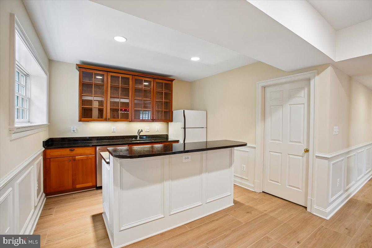 6809 Sorrel Street McLean, VA 22101 - Photo 66 of 101 a kitchen with stainless steel appliances granite countertop a stove and a sink